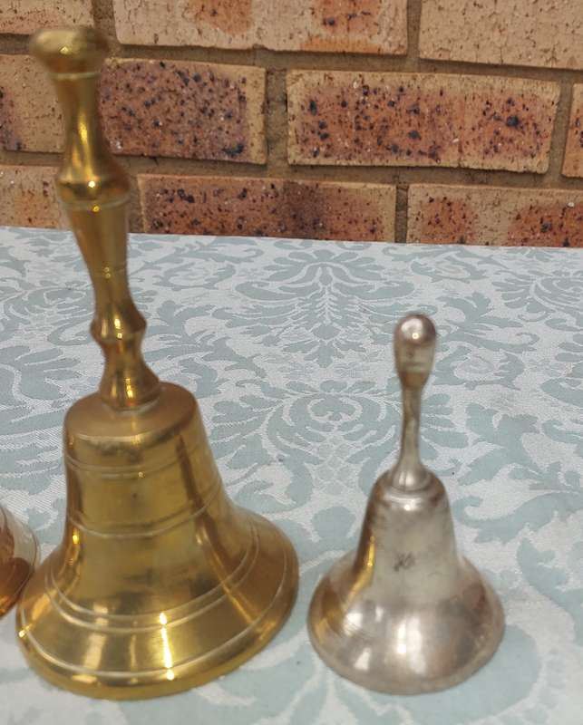 A COLLECTION OF BELLS SOLD AS IS