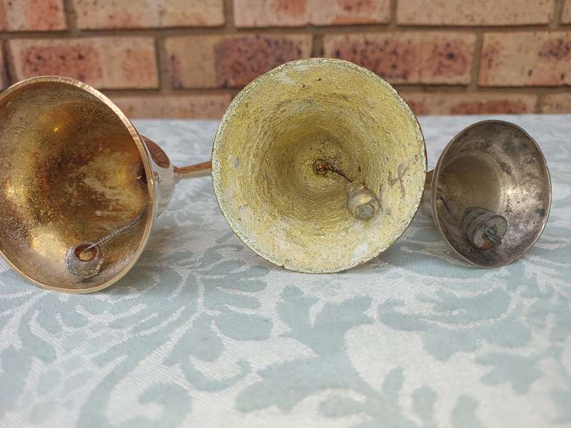 A COLLECTION OF BELLS SOLD AS IS