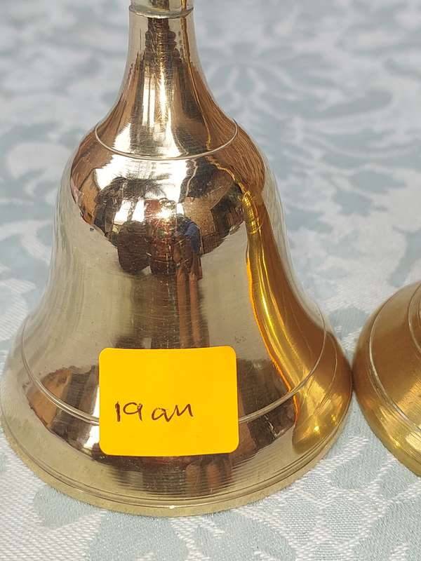 A COLLECTION OF BELLS SOLD AS IS
