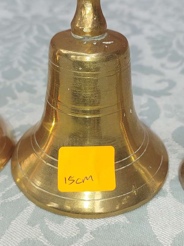 A COLLECTION OF BELLS SOLD AS IS
