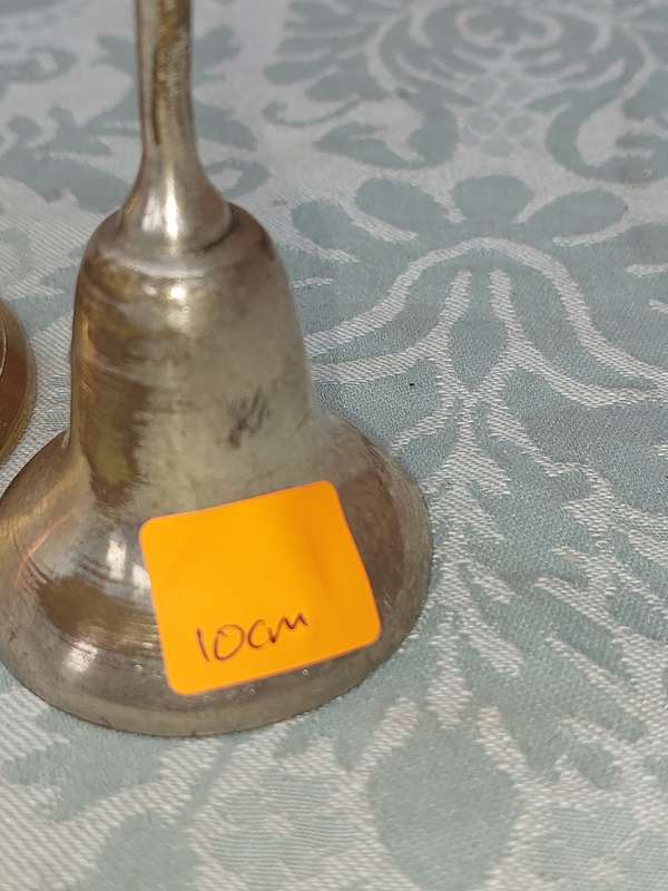 A COLLECTION OF BELLS SOLD AS IS