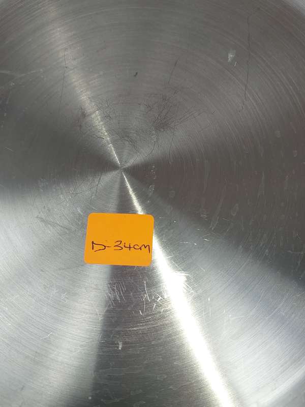 A STAINLESS STEEL SERVING PLATTER SOLD AS IS