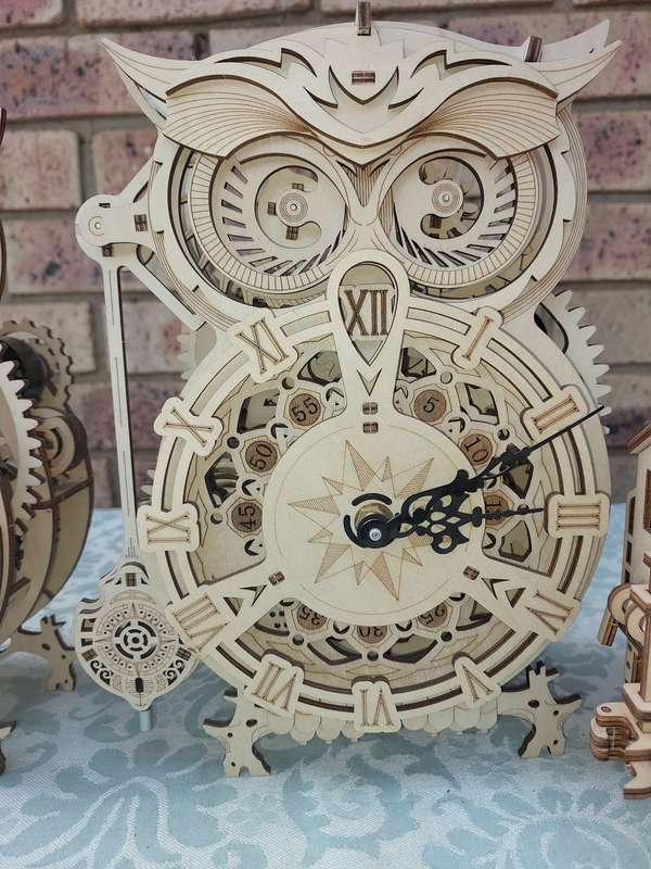 A COLLECTION OF WOODEN PROJECT WATCH OWLS AND A TRAIN ENGINE SOLD AS IS NOT TESTED