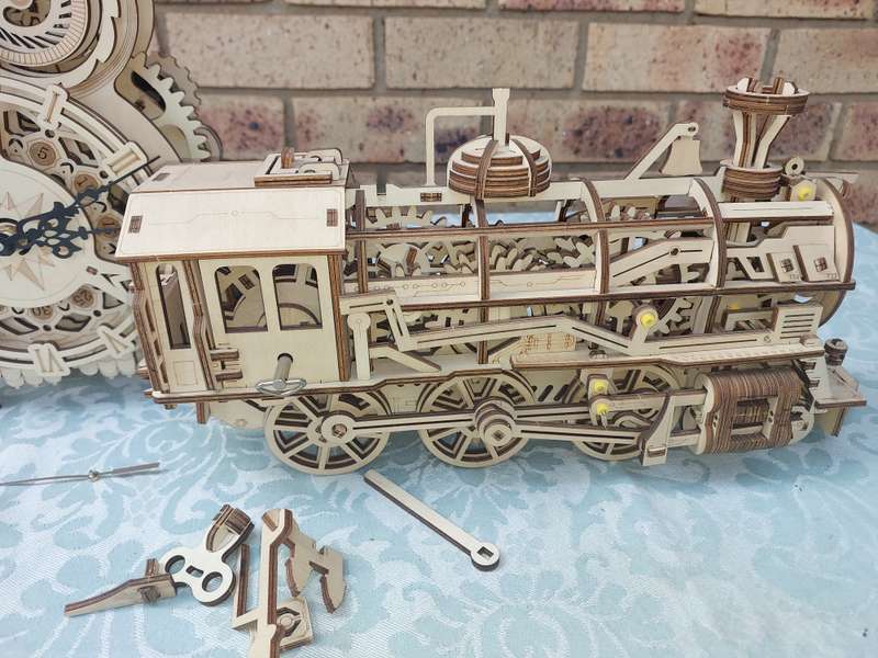 A COLLECTION OF WOODEN PROJECT WATCH OWLS AND A TRAIN ENGINE SOLD AS IS NOT TESTED