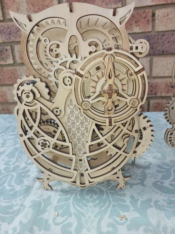 A COLLECTION OF WOODEN PROJECT WATCH OWLS AND A TRAIN ENGINE SOLD AS IS NOT TESTED