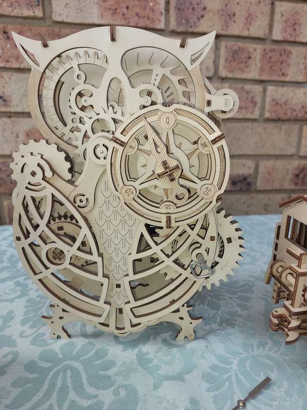 A COLLECTION OF WOODEN PROJECT WATCH OWLS AND A TRAIN ENGINE SOLD AS IS NOT TESTED