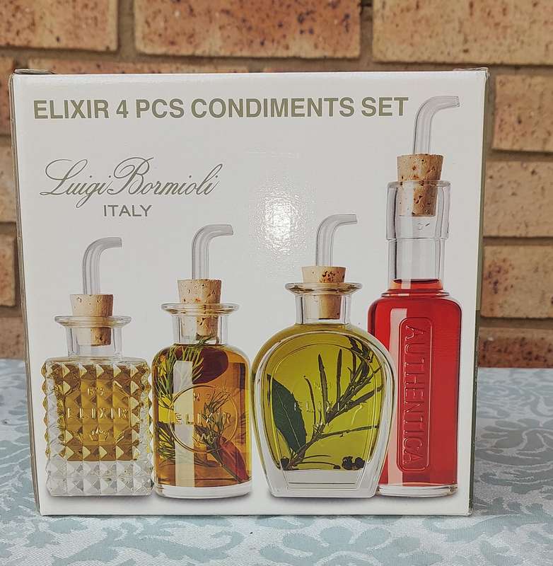 A FLIXIR 4 PIECE CONDIMENTS SET BY LUIGI BORMIOLI ITALY IN ITS ORIGINAL BOX NEVER USED SOLD AS IS