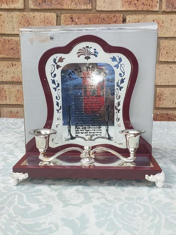 A WOODEN SHABBOT SHALOM CNDLE STAND SOLD AS IS