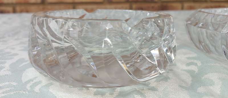 A PAIR OF GLASS ASH TRAYS SOLD AS IS