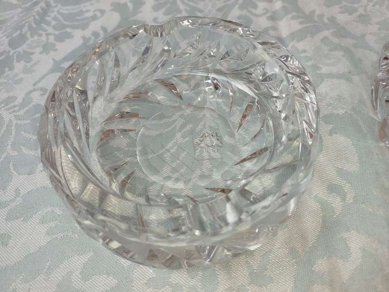 A PAIR OF GLASS ASH TRAYS SOLD AS IS