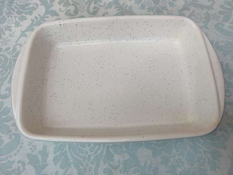 A RECTANGULAR STONE WARE CASSEROLE BY CONTINENTAL SOLD AS IS