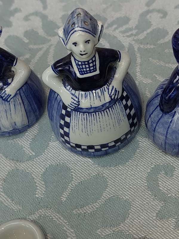 A VINTAGE COLLECTION OF DELFTS BLUE FIGURINES SOLD AS IS
