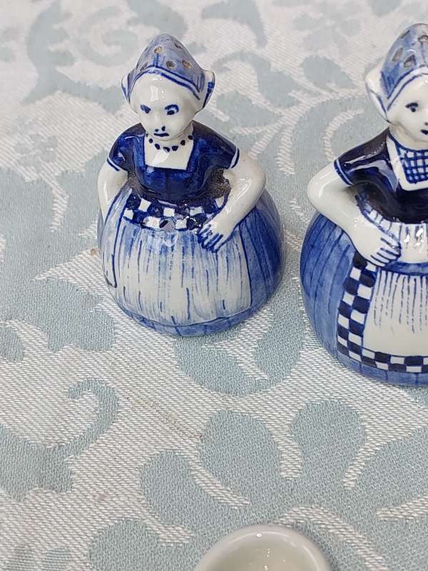 A VINTAGE COLLECTION OF DELFTS BLUE FIGURINES SOLD AS IS