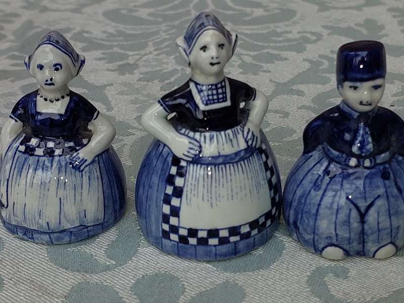 A VINTAGE COLLECTION OF DELFTS BLUE FIGURINES SOLD AS IS