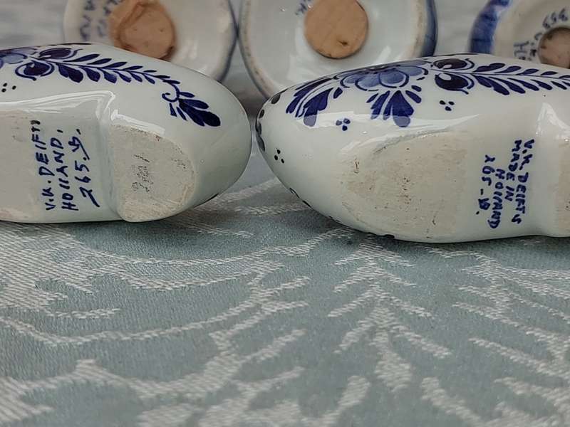 A VINTAGE COLLECTION OF DELFTS BLUE FIGURINES SOLD AS IS
