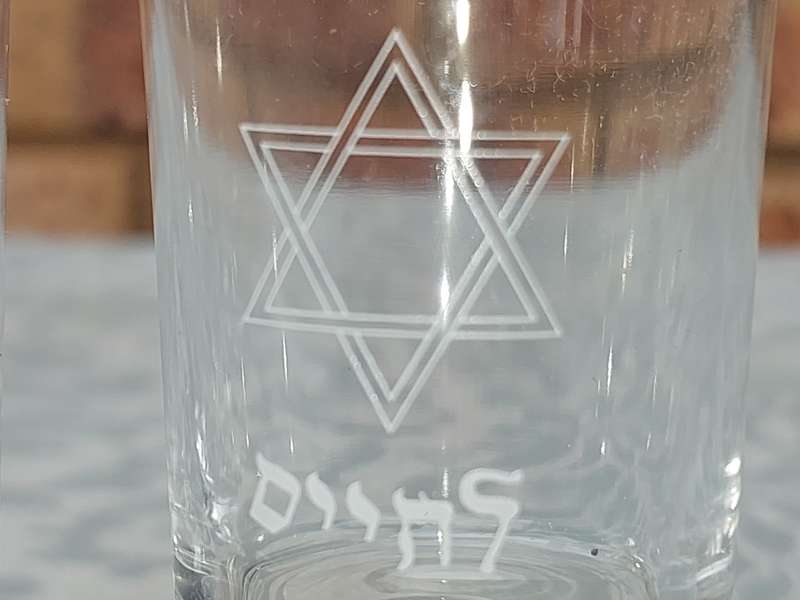 A SET OF 4 KIDDUSH GLASSES SOLD AS IS