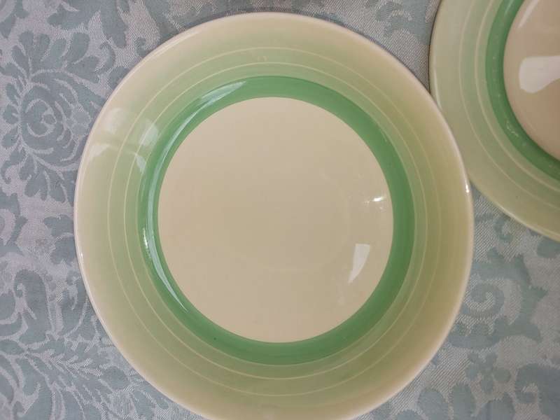 A VINTAHE COLLECTION OF TWO SOUP BOWLS AND A SIDE PLATE BY ROYAL DOULTON