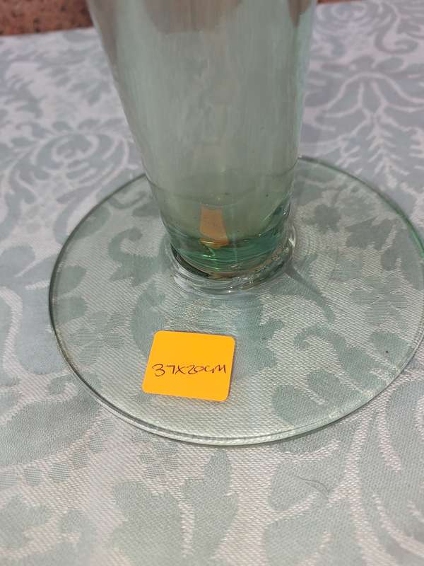 AN ART DECOR GREEN TINTED GLASS VASE SOLD AS IS