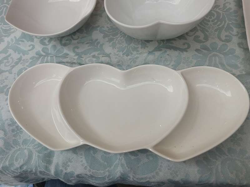 A COLLECTION OF 7 WHITE PORCELAIN SERVING PLATTERS SOLD AS IS
