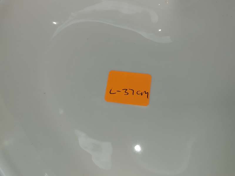 A COLLECTION OF 7 WHITE PORCELAIN SERVING PLATTERS SOLD AS IS