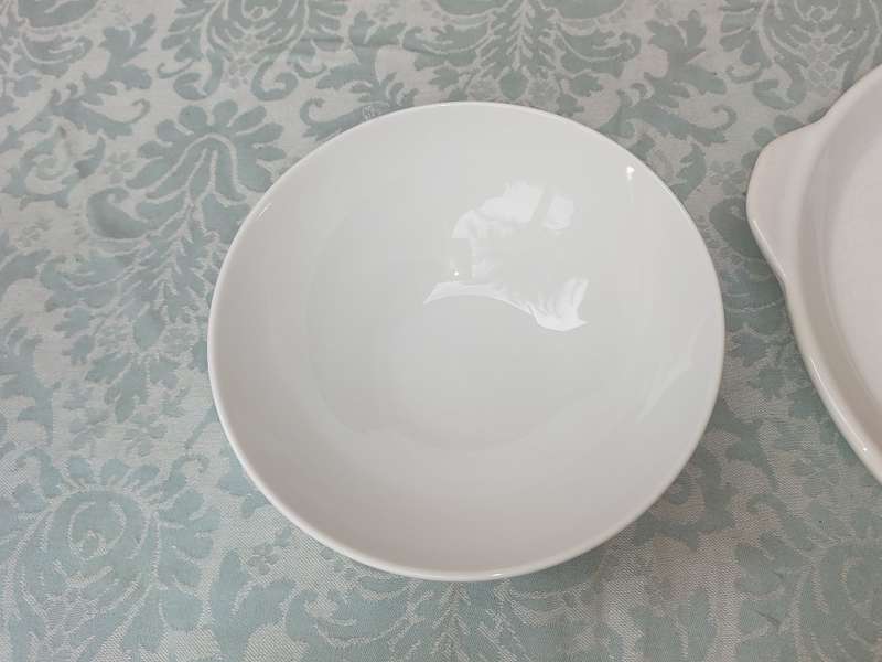 A COLLECTION OF 7 WHITE PORCELAIN SERVING PLATTERS SOLD AS IS
