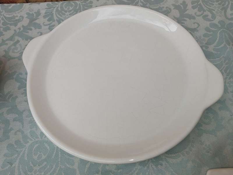 A COLLECTION OF 7 WHITE PORCELAIN SERVING PLATTERS SOLD AS IS