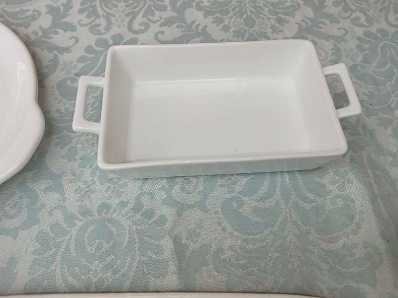 A COLLECTION OF 7 WHITE PORCELAIN SERVING PLATTERS SOLD AS IS