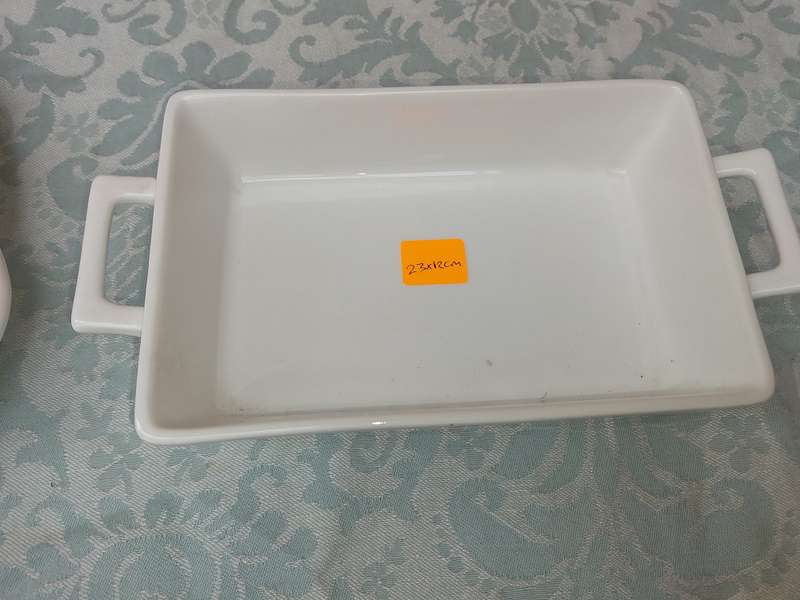 A COLLECTION OF 7 WHITE PORCELAIN SERVING PLATTERS SOLD AS IS
