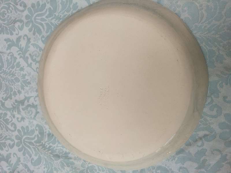 A WONKI WARE CAKE PLATE SOLD AS IS