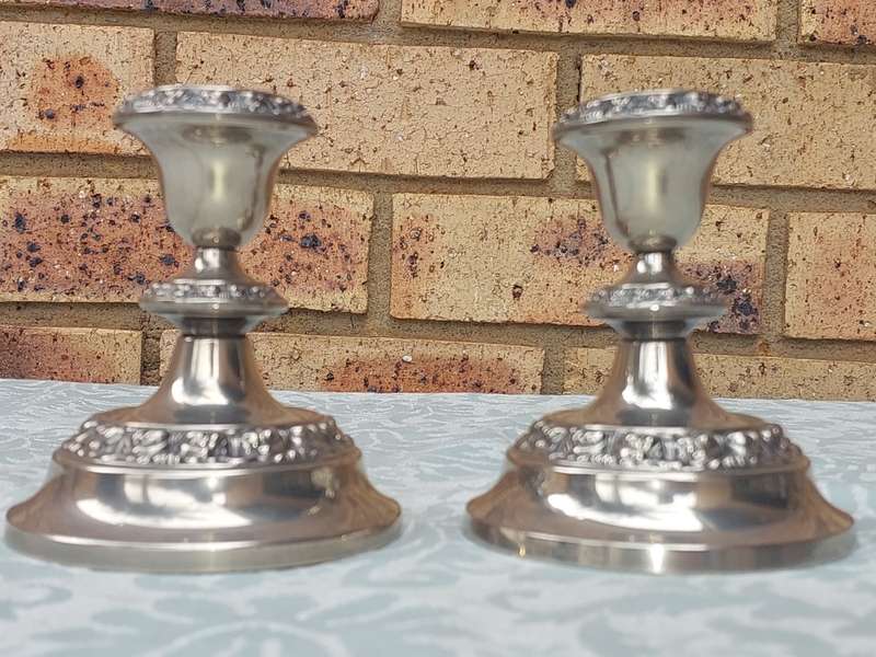 A SET OF TWO SHORT TABLE TOP CANDLES HOLDERS SOLD AS IS