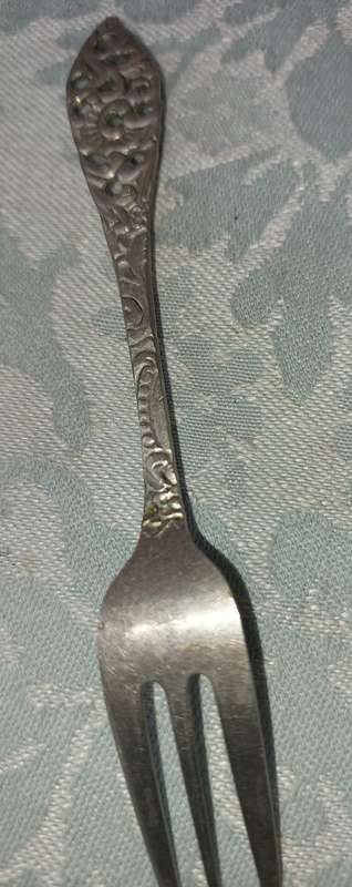 AN ART DECOR  STAINLESS STEEL SET OF CAKE FORKS SOLD AS IS