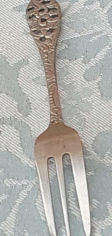 AN ART DECOR  STAINLESS STEEL SET OF CAKE FORKS SOLD AS IS