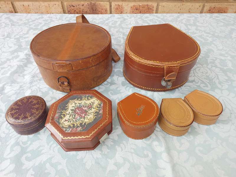 A VINTAGE AND AN ANTIQUE COLLECTION LEATHER BOUND JEWELRY BOXES SOLD AS IS
