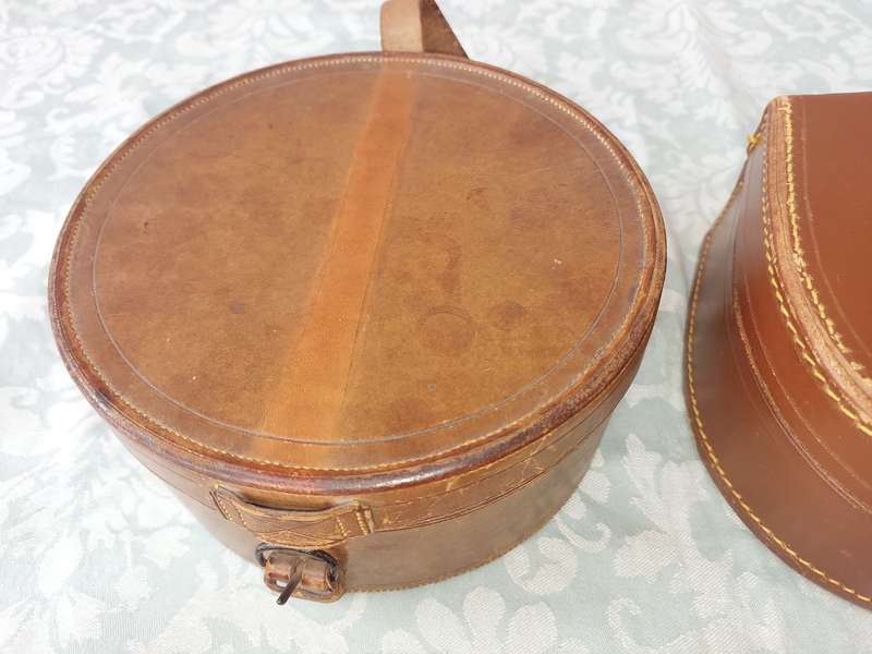 A VINTAGE AND AN ANTIQUE COLLECTION LEATHER BOUND JEWELRY BOXES SOLD AS IS