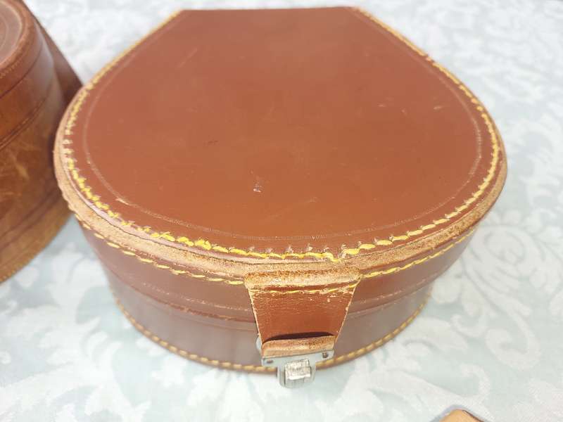 A VINTAGE AND AN ANTIQUE COLLECTION LEATHER BOUND JEWELRY BOXES SOLD AS IS