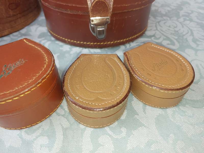 A VINTAGE AND AN ANTIQUE COLLECTION LEATHER BOUND JEWELRY BOXES SOLD AS IS