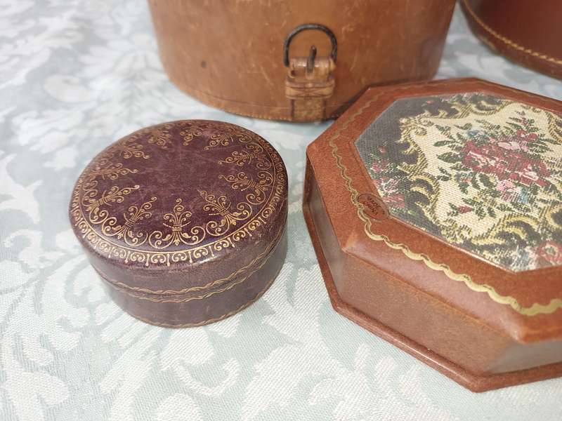 A VINTAGE AND AN ANTIQUE COLLECTION LEATHER BOUND JEWELRY BOXES SOLD AS IS