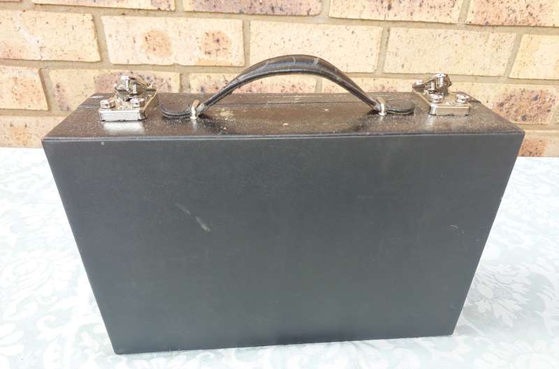 A BLACK LEATHER CASE FOR THE AVID WATCH COLLECTOR WITH KEYS  THE CASE HAS A FEW SCRATCHES SOLD AS IS