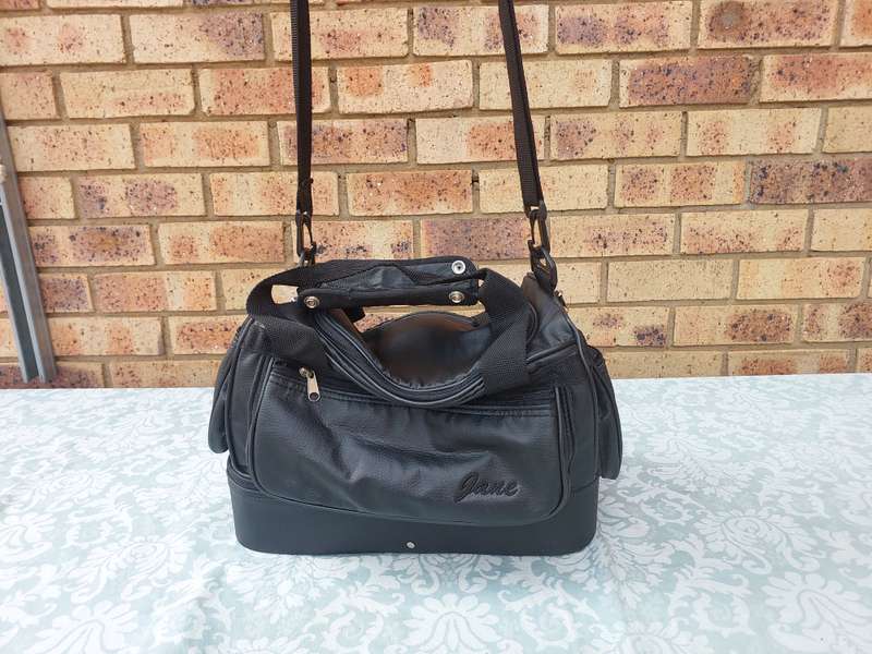 A BLACK FAUX LEATHER BAG FOR THE LADIES SOLD AS IS