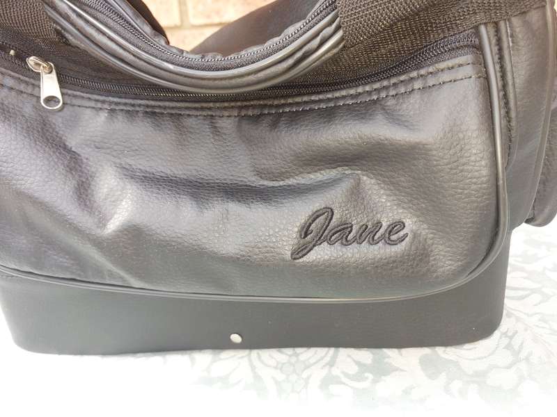 A BLACK FAUX LEATHER BAG FOR THE LADIES SOLD AS IS
