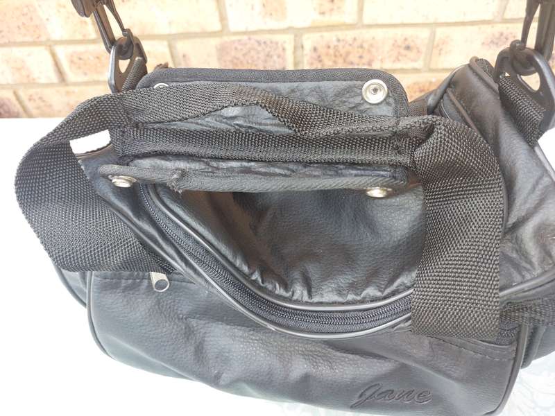 A BLACK FAUX LEATHER BAG FOR THE LADIES SOLD AS IS