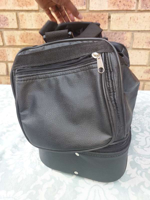 A BLACK FAUX LEATHER BAG FOR THE LADIES SOLD AS IS