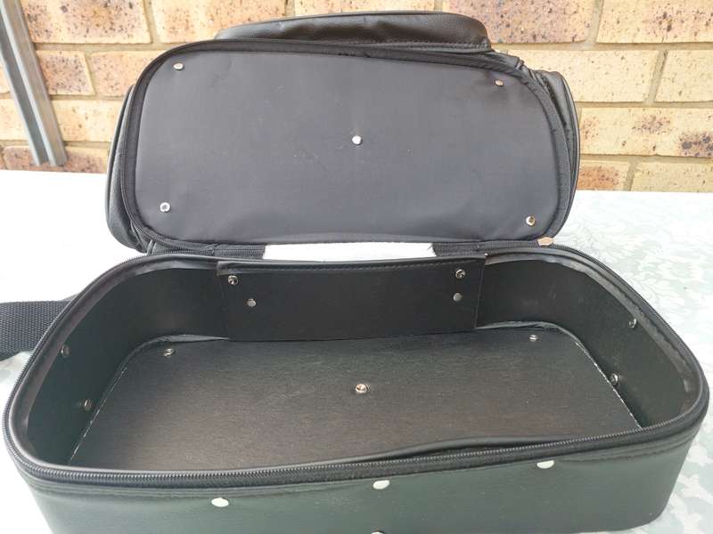 A BLACK FAUX LEATHER BAG FOR THE LADIES SOLD AS IS