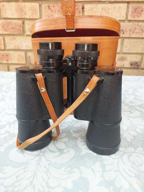 A VINTAGE ROS TRIPLE COATED TESTED OIOTIC 10X 50 BINOCULARS SOLD AS IS