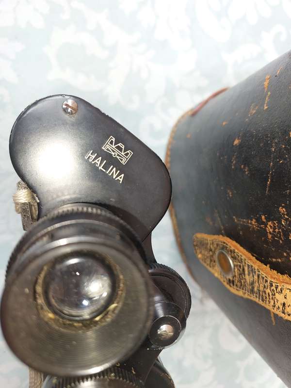 A VINTAGE HALINA HARD COATED LENSE 7X50 BINOCULARS SOLD AS IS
