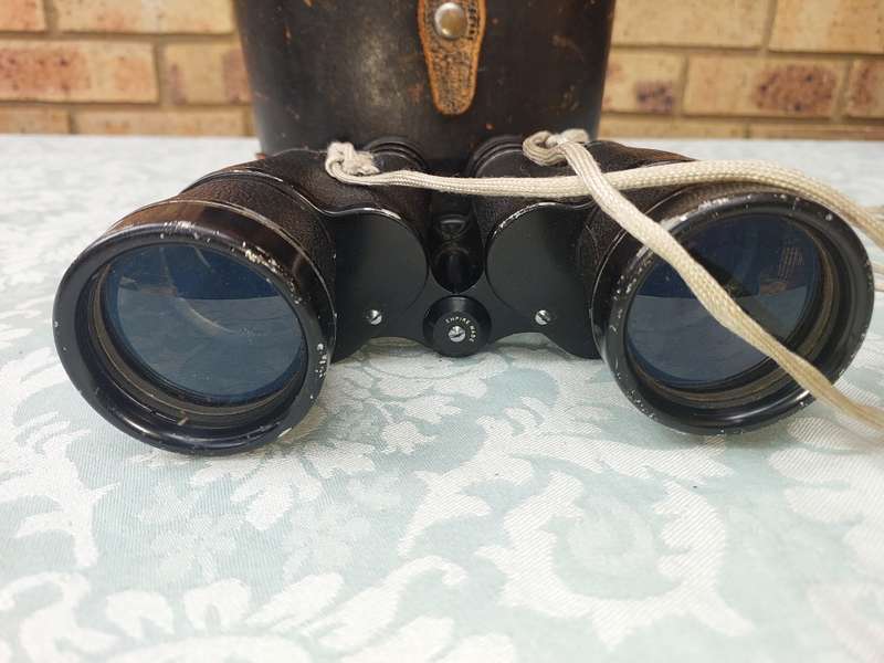 A VINTAGE HALINA HARD COATED LENSE 7X50 BINOCULARS SOLD AS IS