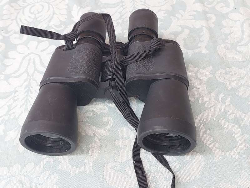 A USED 60X60 BINOCULARS SOLD AS IS