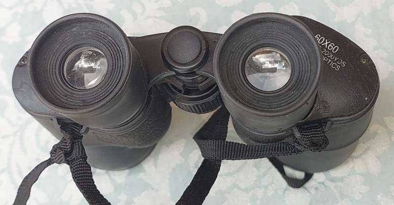 A USED 60X60 BINOCULARS SOLD AS IS