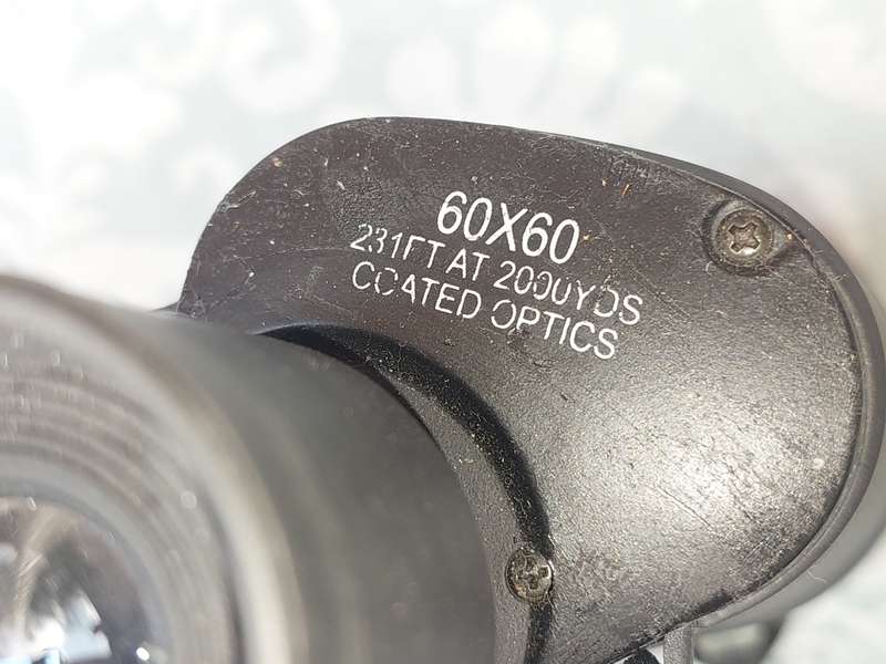 A USED 60X60 BINOCULARS SOLD AS IS