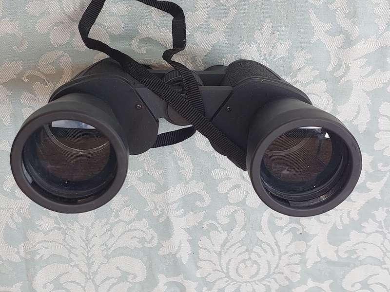 A USED 60X60 BINOCULARS SOLD AS IS